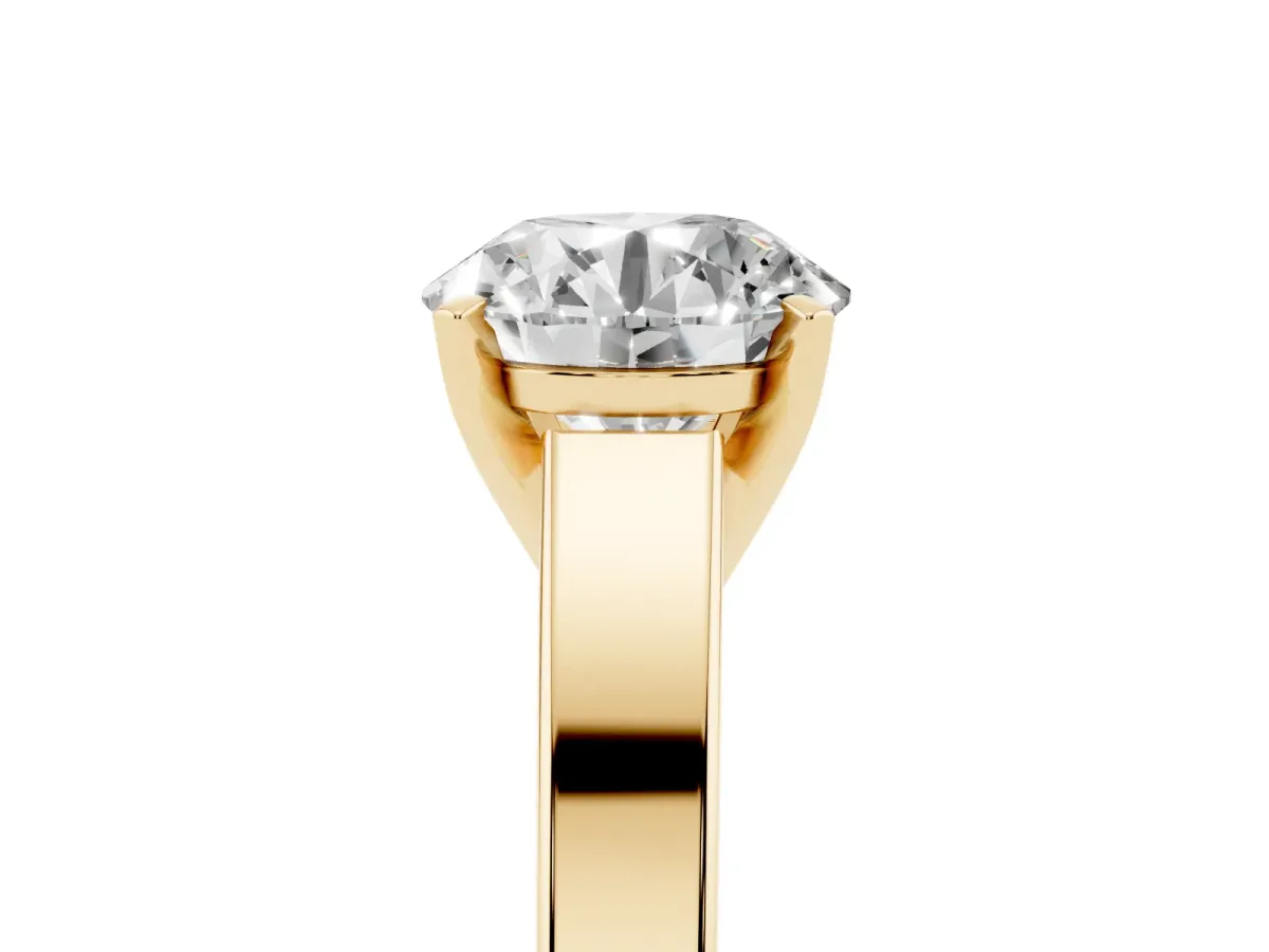 Round Cut Solitaire Engagement Ring with Four-Prong Setting and Tapered Band Yellow gold