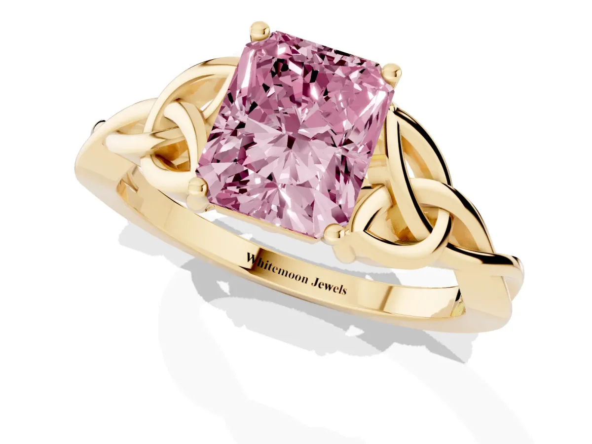 Fancy Pink Radiant Cut Diamond Solitaire Engagement Ring with Celtic Knot Band and Four-Prong Setting Yellow gold