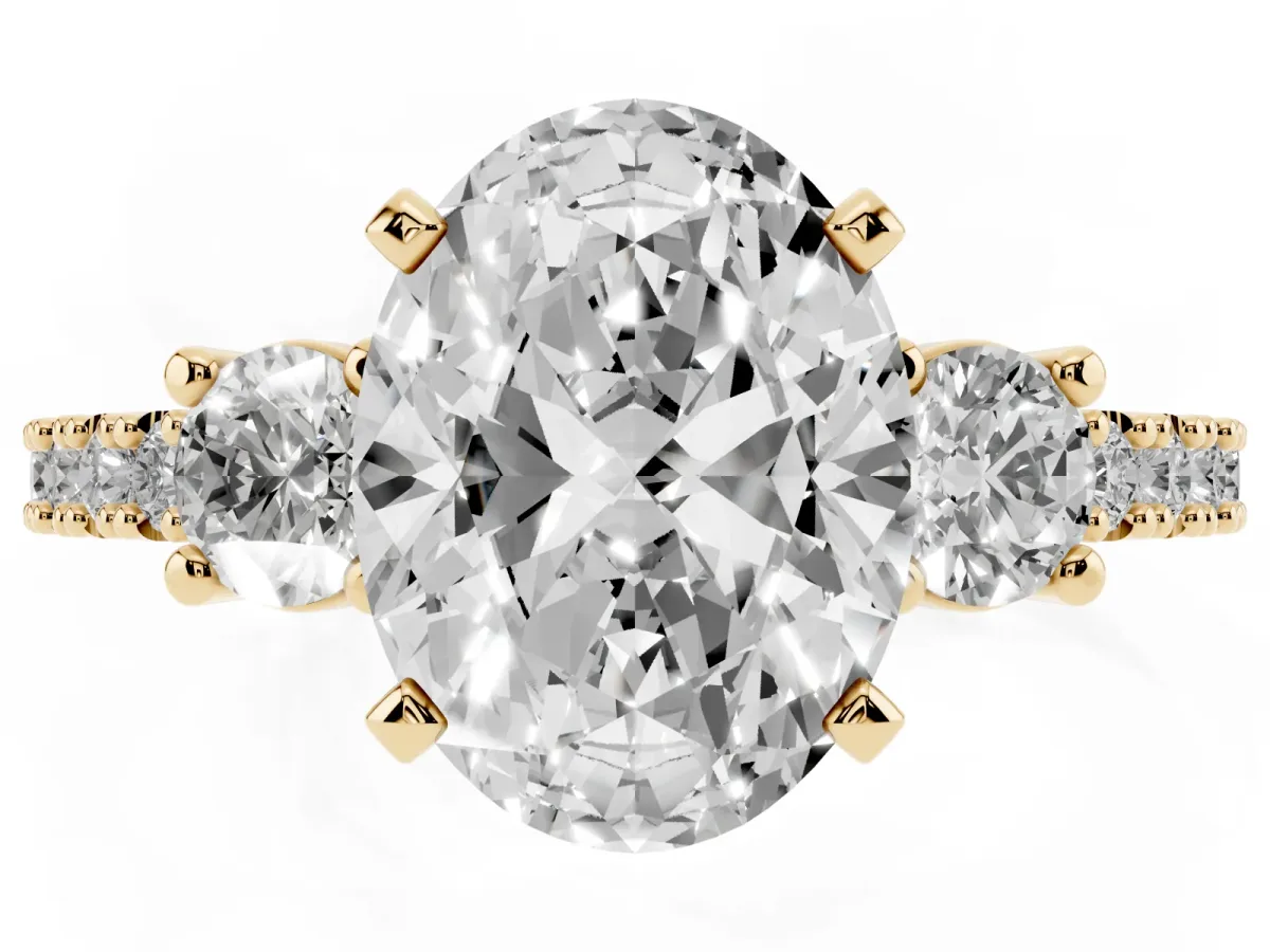 Oval Cut Three-Stone Diamond Pavé Band with Prong Setting Yellow gold