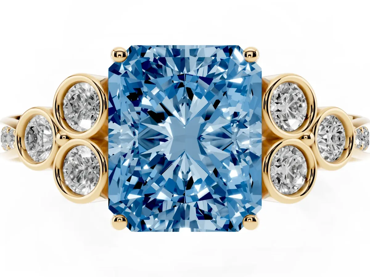 Fancy Blue Radiant Cut Cut Diamond Engagement Ring with Bezel Set Round Side Stones and Prong Setting Yellow gold