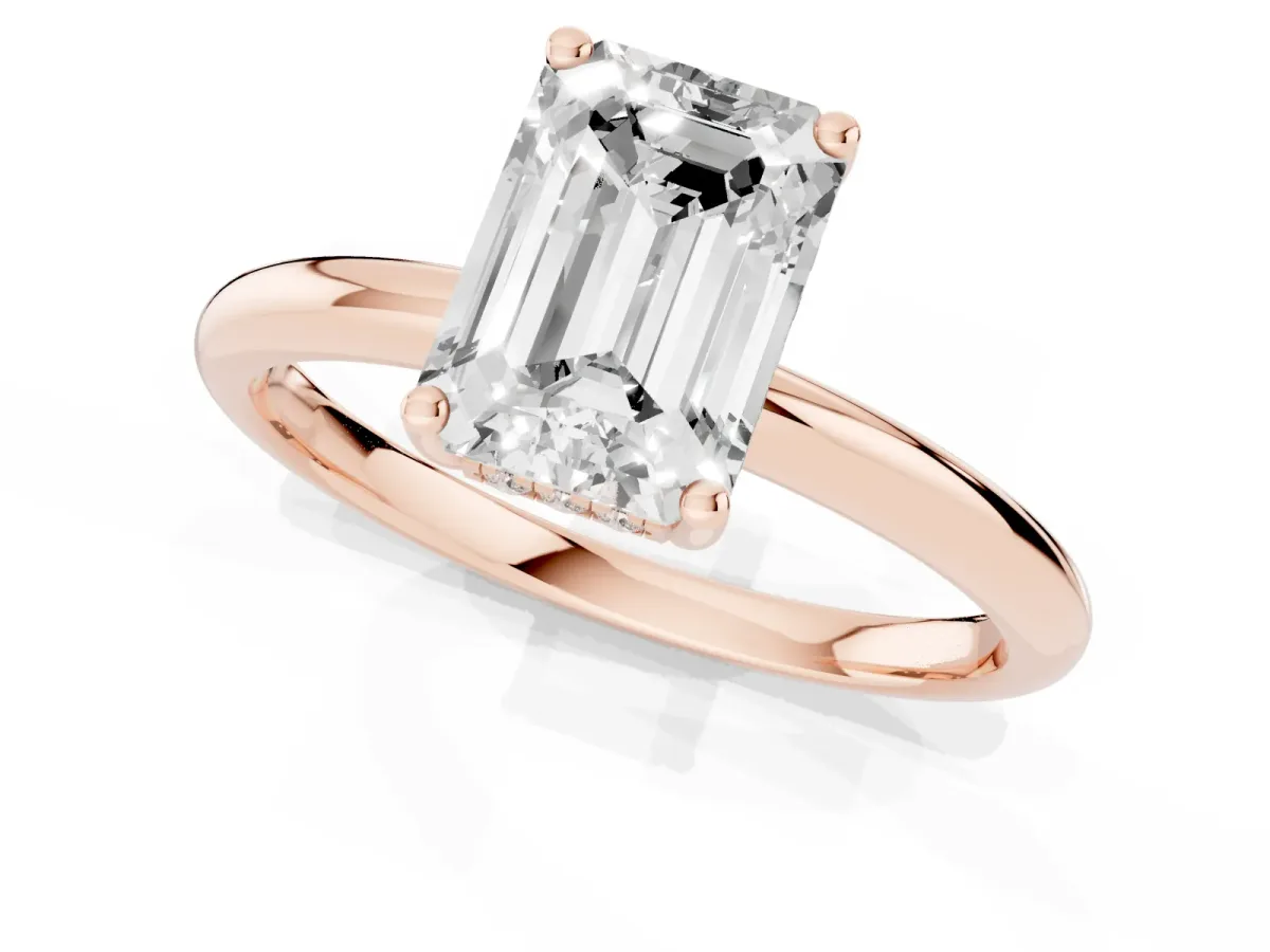 Emerald Cut Cut Solitaire Engagement Ring with Four-Prong Setting and Classic Band Rose gold