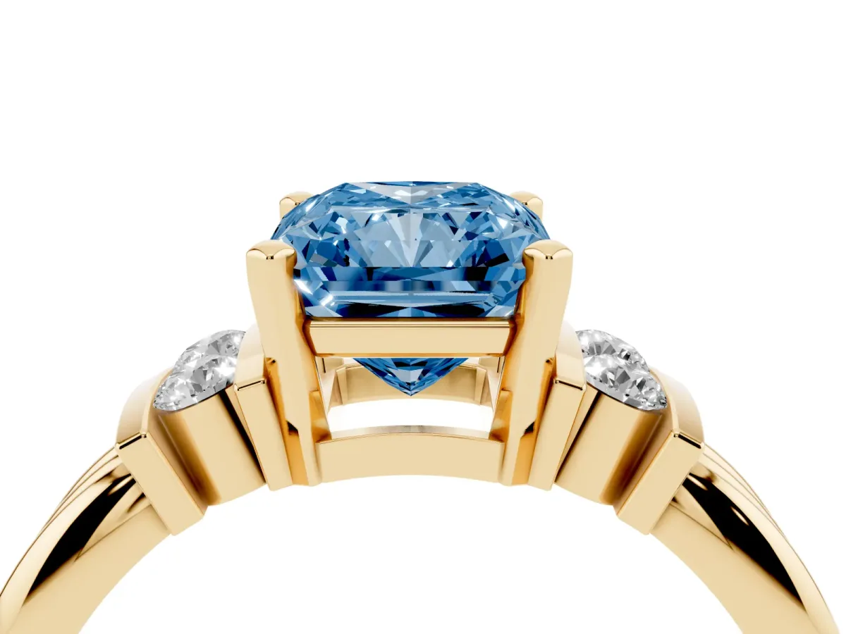 Fancy Blue Radiant Cut Cut Three-Stone Channel Set Ring with Bar Prongs Yellow gold