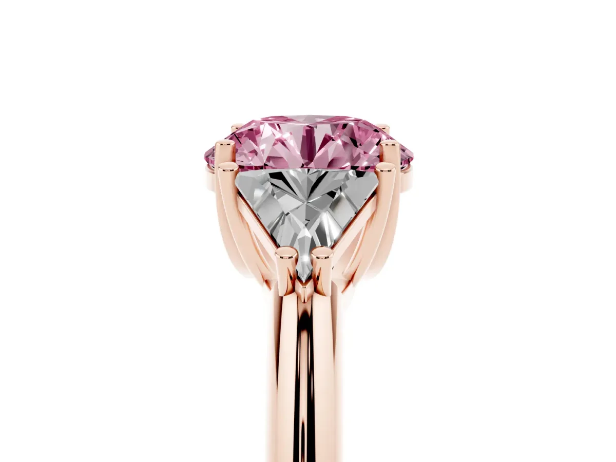 Fancy Pink Three-Stone Round Cut Diamond Engagement Ring with Trillion Side Stones and Prong Setting Rose gold