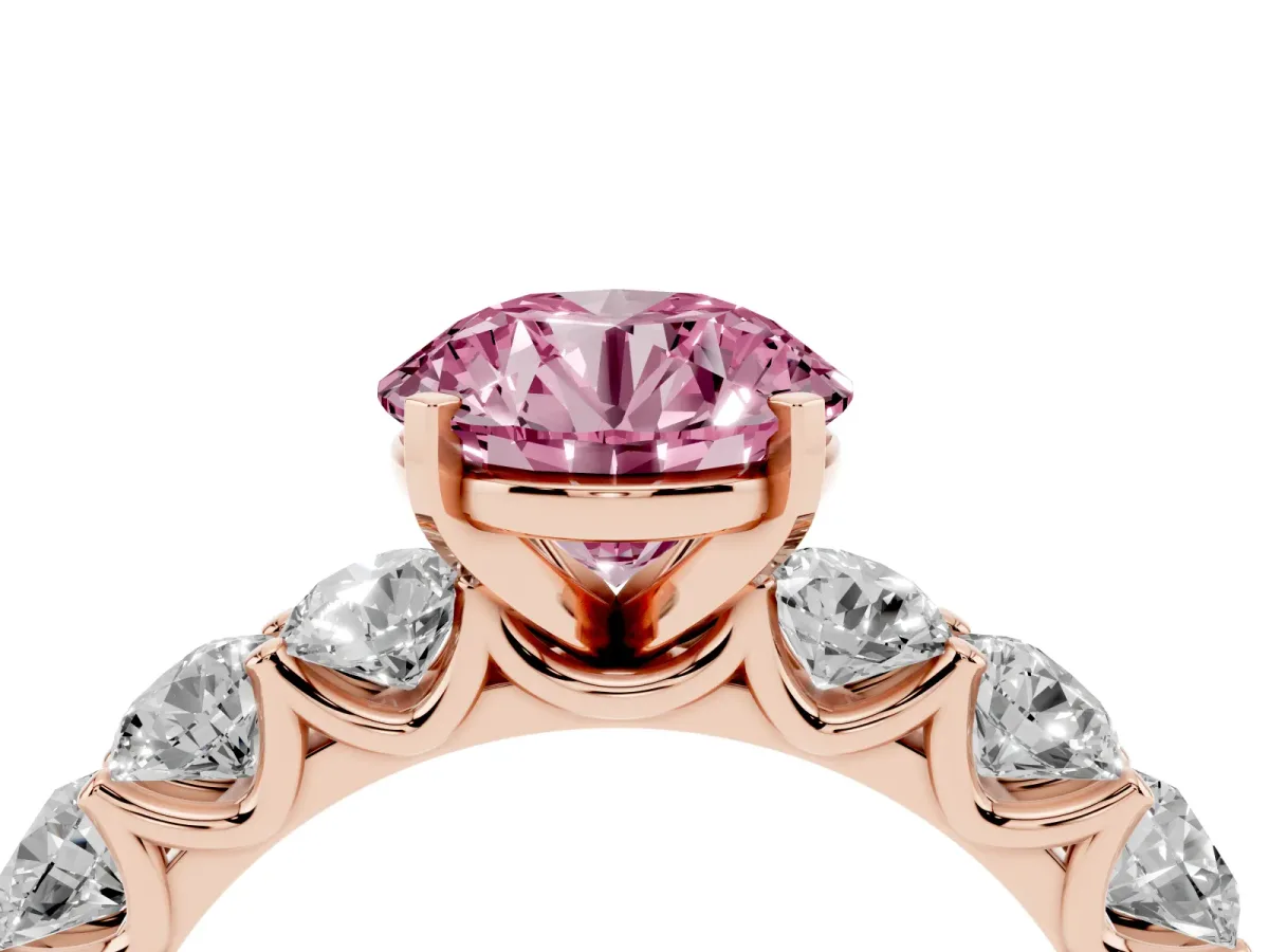 Fancy Pink Round Cut Diamond Prong Setting with Side Stones on a Pave Band Rose gold