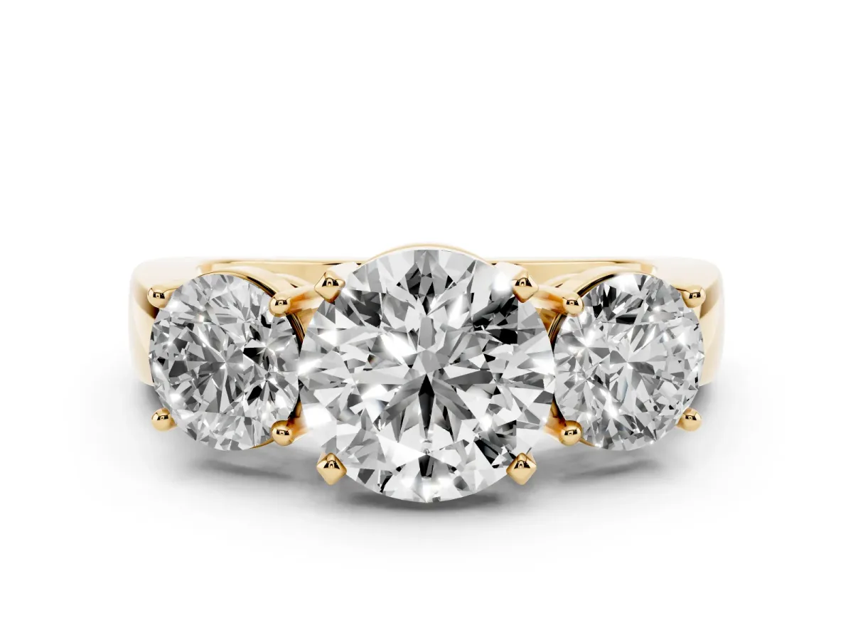 Three-Stone Round Cut Diamond Ring with Round Side Stones, Classic Band, and Four-Prong Setting Yellow gold