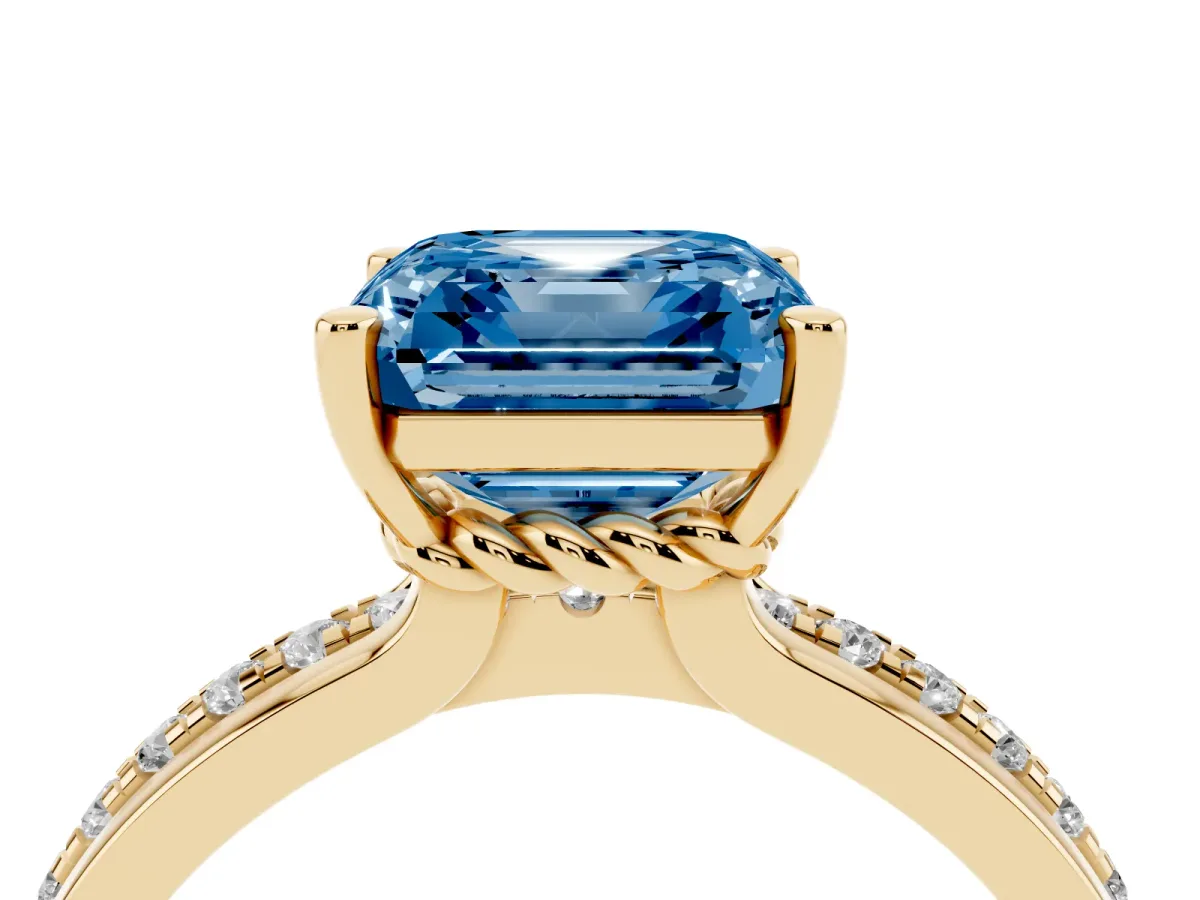Fancy Blue Asscher Cut Solitaire Diamond Ring with Channel Set Band and Six-Prong Setting Yellow gold