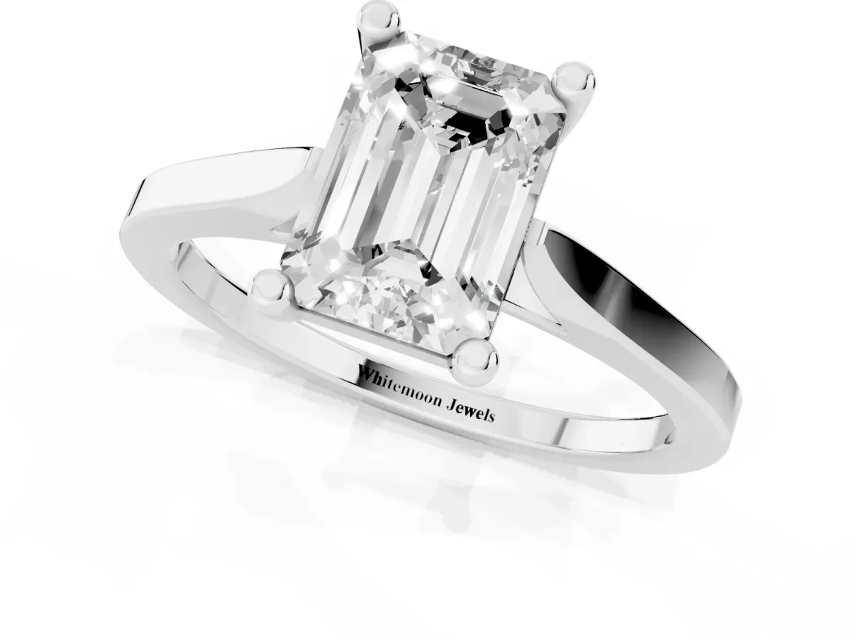 Emerald Cut Solitaire Diamond Ring with Four-Prong Setting and Tapered Band White gold