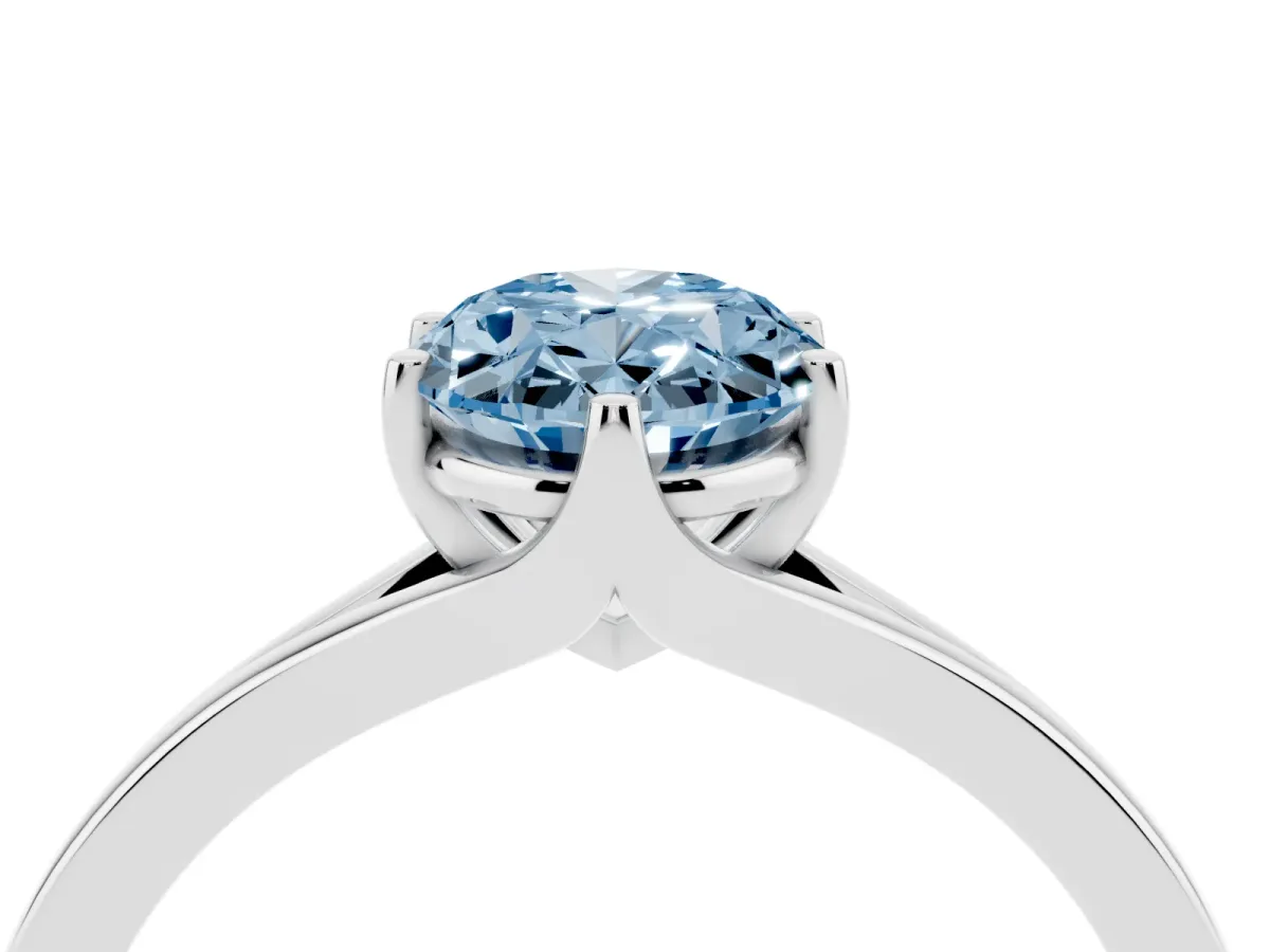 Fancy Blue Oval Cut Solitaire Diamond Ring with Six-Prong Setting and Tapered Band Silver