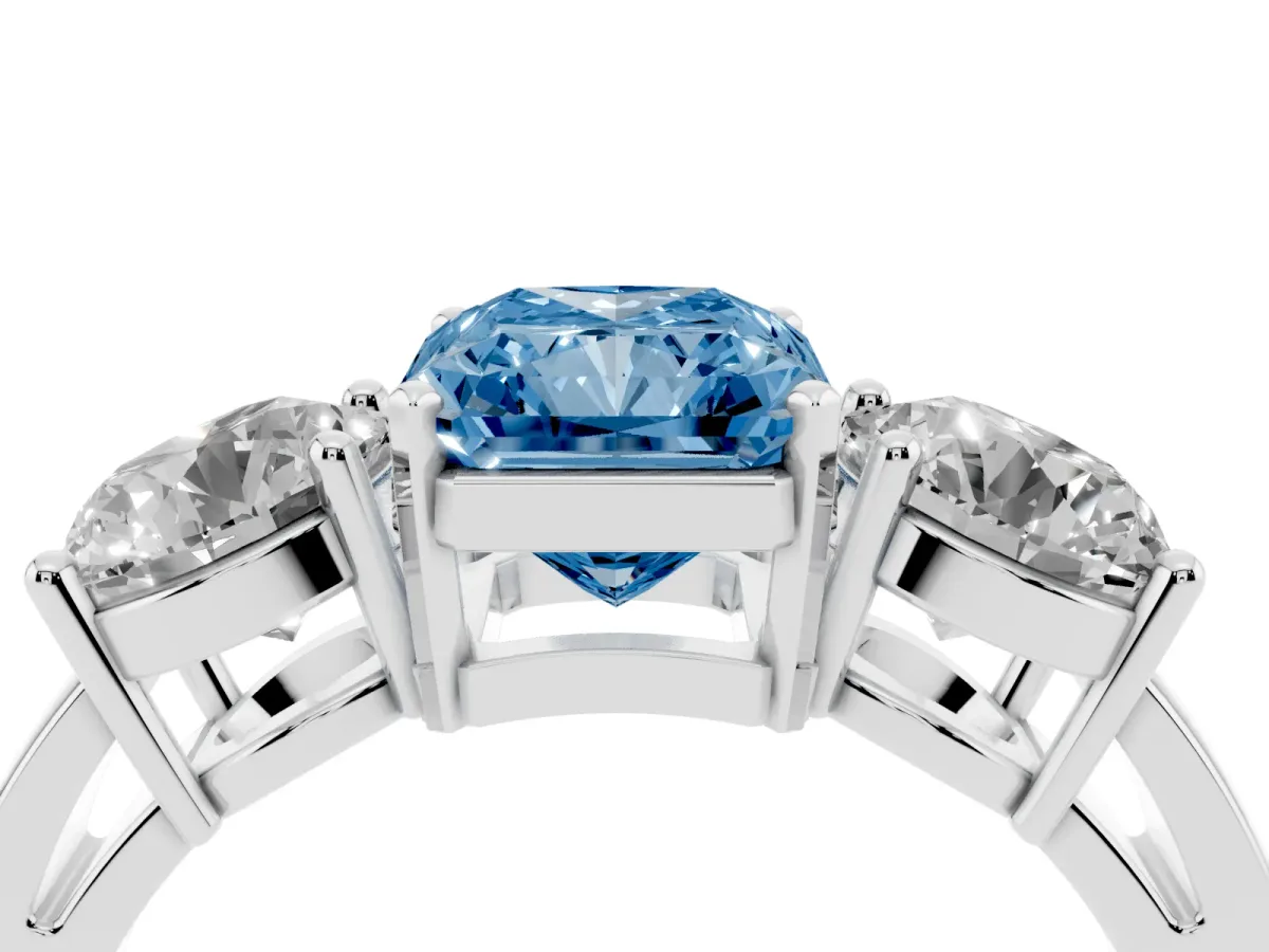 Fancy Blue Three-Stone Radiant Cut Diamond Ring with Round Side Stones, Classic Band, and Four-Prong Setting Platinum