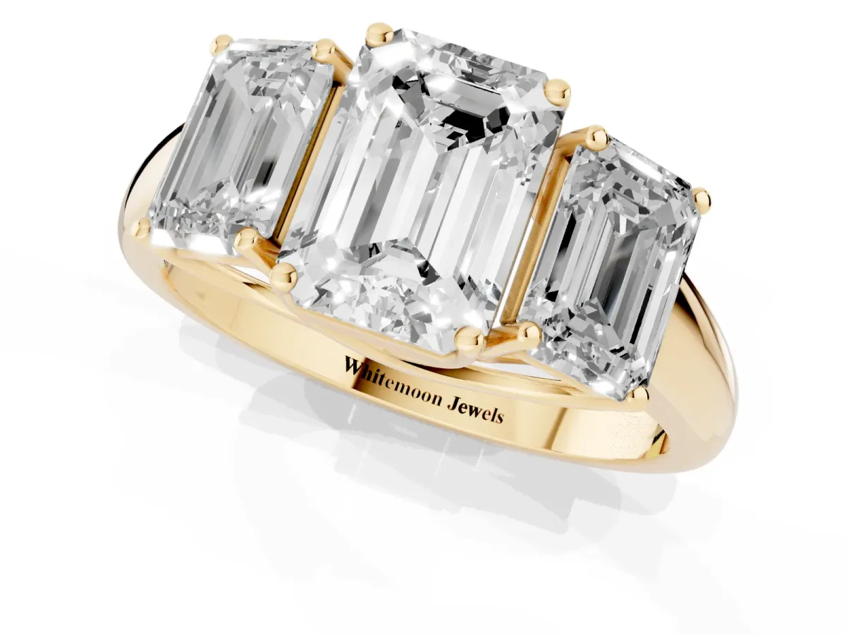Three-Stone Emerald Cut Diamond Engagement Ring with Prong Setting Yellow gold
