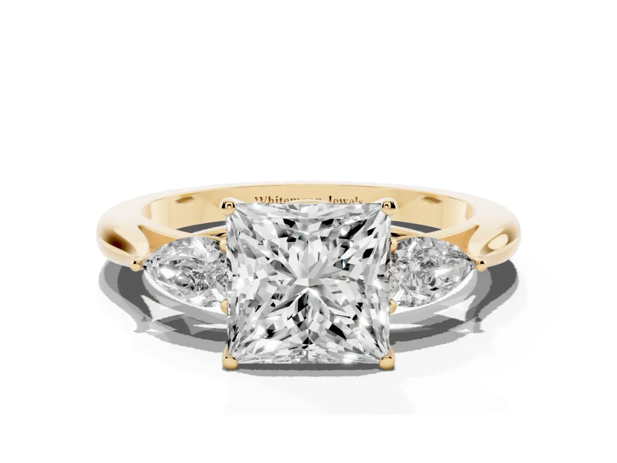 Three-Stone Princess Cut Diamond Ring with Pear Side Stones in Four-Prong Setting Yellow gold