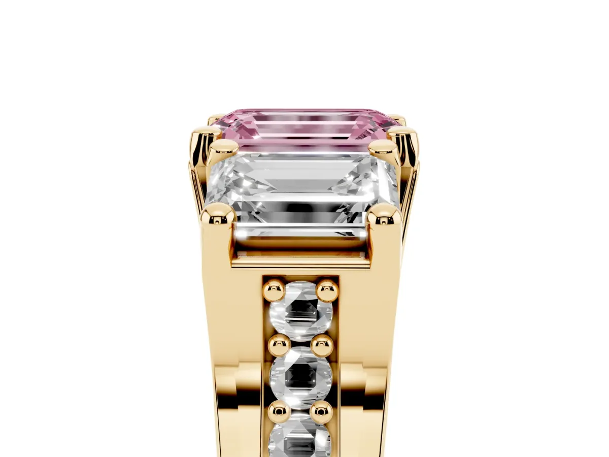 Fancy Pink Emerald Cut Diamond Three-Stone Ring with Channel Set Band and Four-Prong Setting Yellow gold