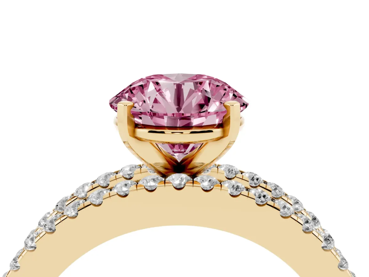 Fancy Pink Round Cut Diamond Solitaire Ring with Pavé and Channel Set Band Yellow gold