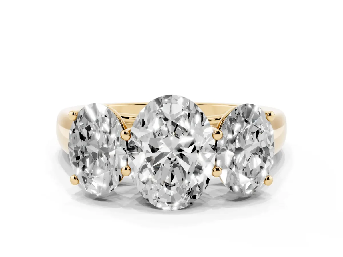Oval Cut Three-Stone Diamond Ring with Prong Setting on a Classic Band Yellow gold