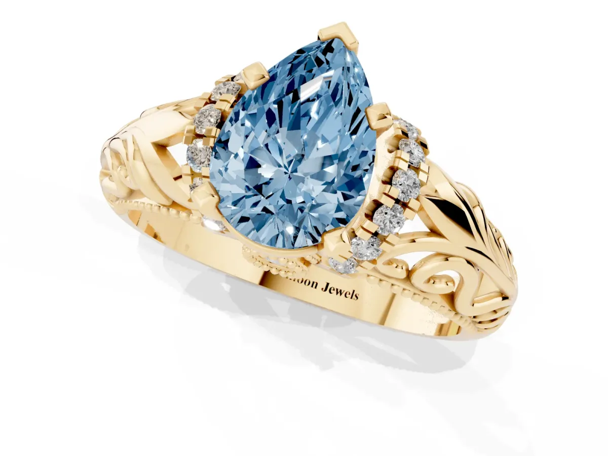 Fancy Blue Pear Cut Solitaire Filigree Engagement Ring with Halo and Prong Setting Yellow gold