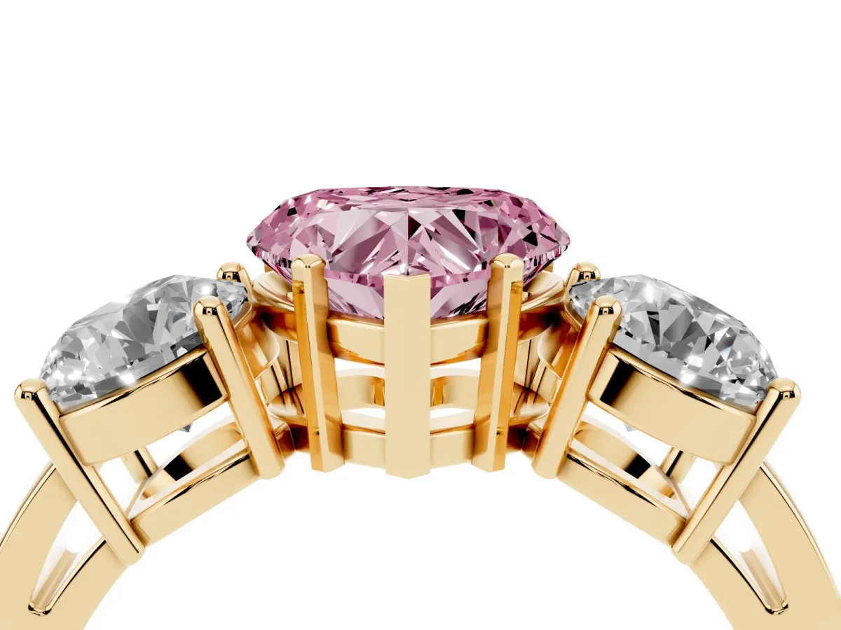 Fancy Pink Three-Stone Heart Cut Diamond Ring with Round Side Stones, Classic Band, and Four-Prong Setting Yellow gold