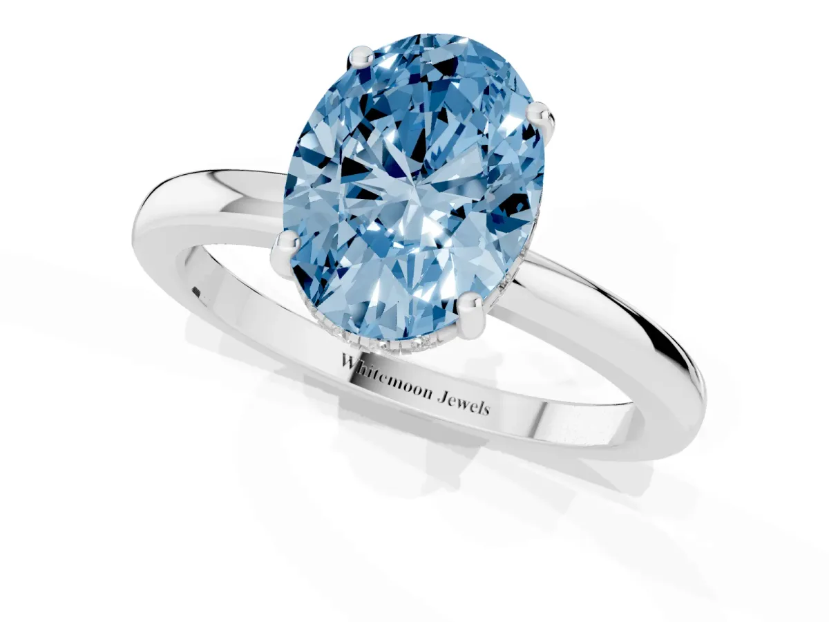 Fancy Blue Oval Cut Solitaire Diamond Ring with Prong Setting and Plain Band Platinum