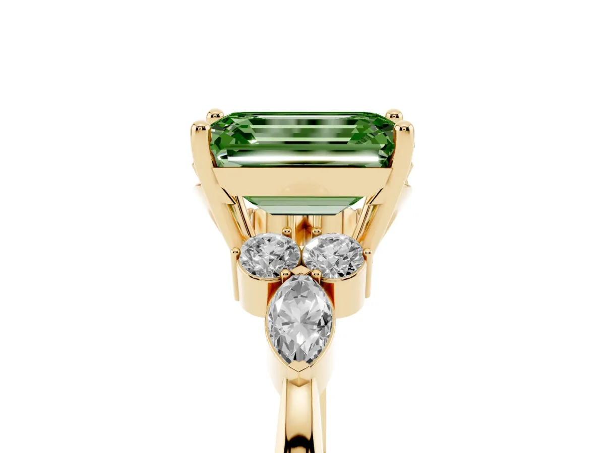 Fancy Green Emerald Cut Brilliant Diamond Solitaire Ring with Pear Side Stones and Four-Prong Setting Yellow gold