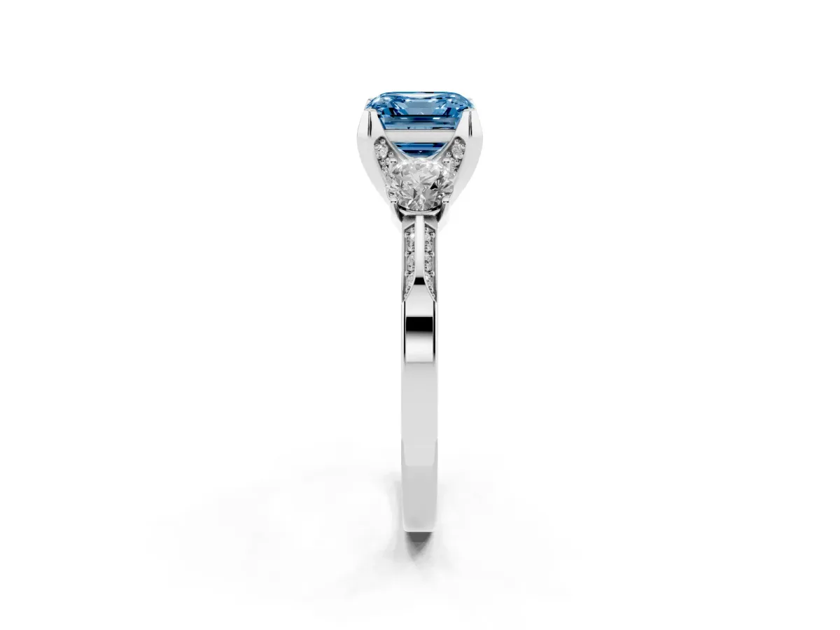 Fancy Blue Asscher Cut Brilliant Three-Stone Diamond Ring with Pavé Band and Four-Prong Setting White gold