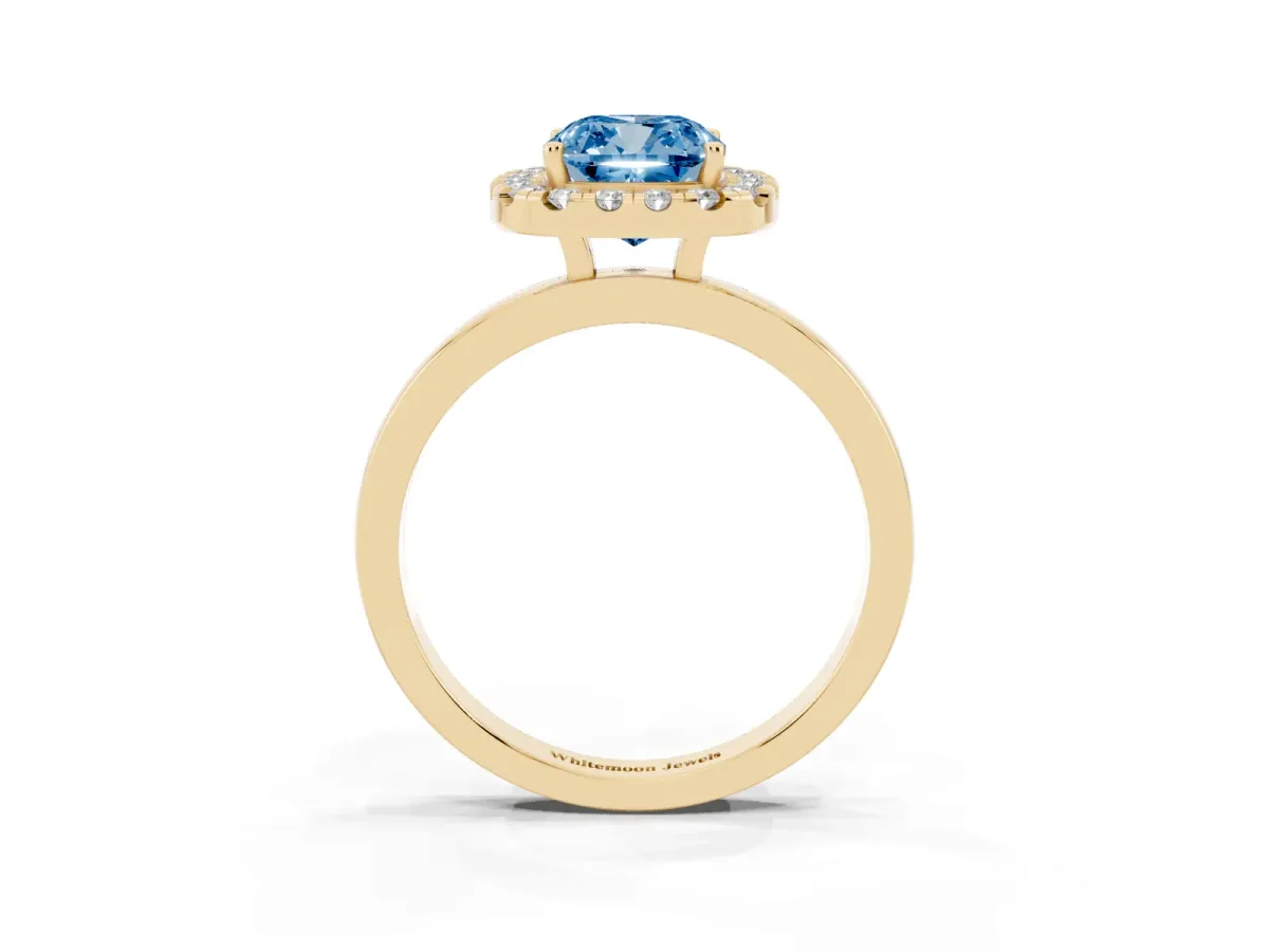 Fancy Blue Cushion Cut Halo Diamond Solitaire with Pavé Band and Four-Prong Setting Yellow gold