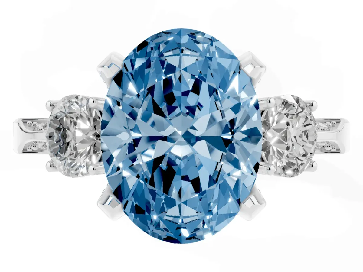 Fancy Blue Oval Cut Brilliant Three-Stone Diamond Ring with Pavé Band and Four-Prong Setting White gold