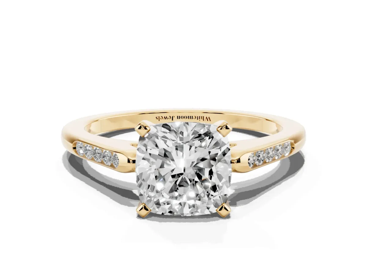 Cushion Cut Diamond Solitaire Ring with Channel Set Round Band and Prong Setting Yellow gold