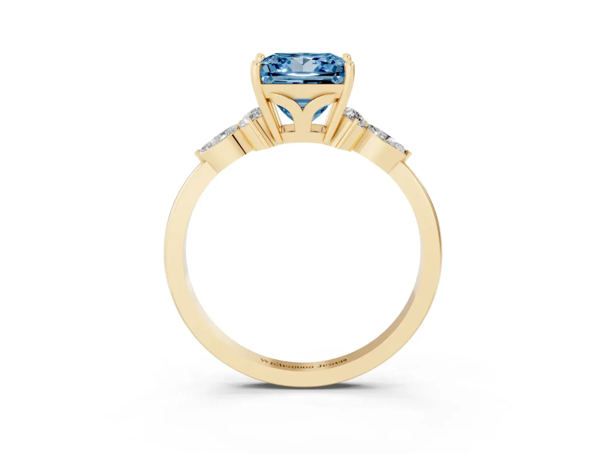 Fancy Blue Princess Cut Brilliant Diamond Solitaire Ring with Pear Side Stones and Four-Prong Setting Yellow gold