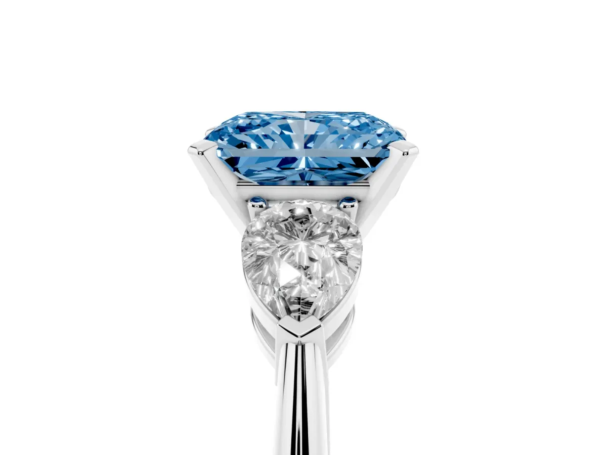 Fancy Blue Three-Stone Radiant Cut Diamond Ring with Pear Side Stones and Four-Prong Setting Platinum