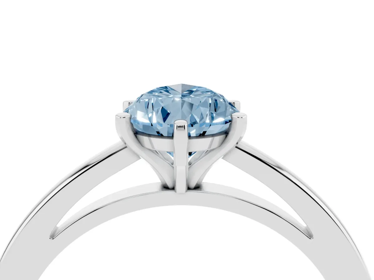Fancy Blue Pear Cut Solitaire Diamond Engagement Ring with Four-Prong Setting on a Classic Band Silver