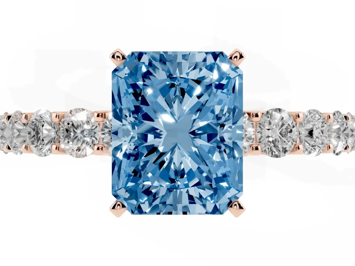 Fancy Blue Radiant Cut Diamond Solitaire Ring with Shared Prong Pavé Band and Four-Prong Setting Rose gold