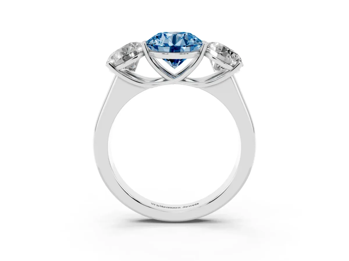 Fancy Blue Round Cut Three-Stone Diamond Ring with Prong Setting on a Classic Band Silver