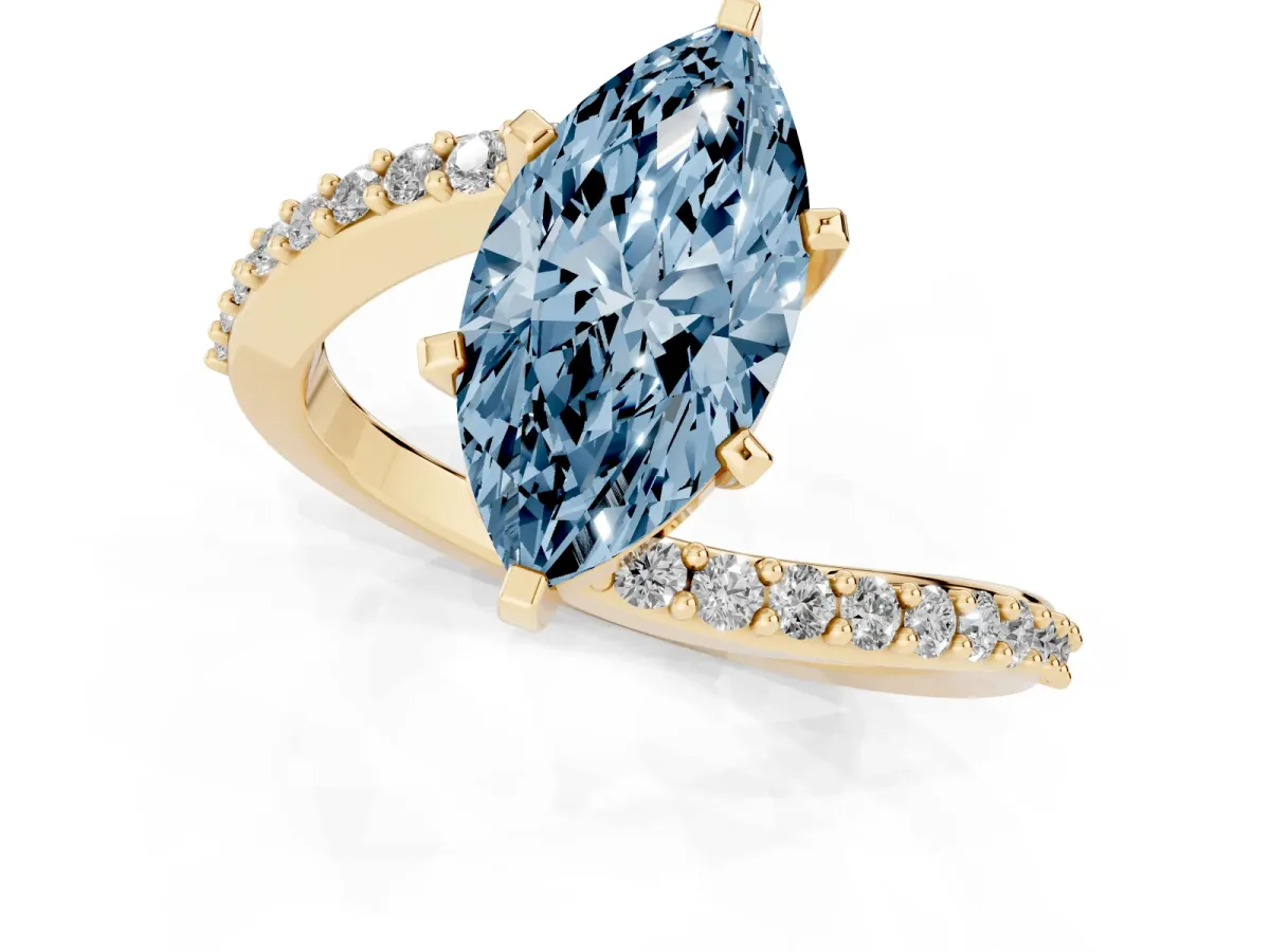 Fancy Blue Marquise Cut Solitaire Twist Band with Pave Set Diamonds and Four-Prong Setting Yellow gold