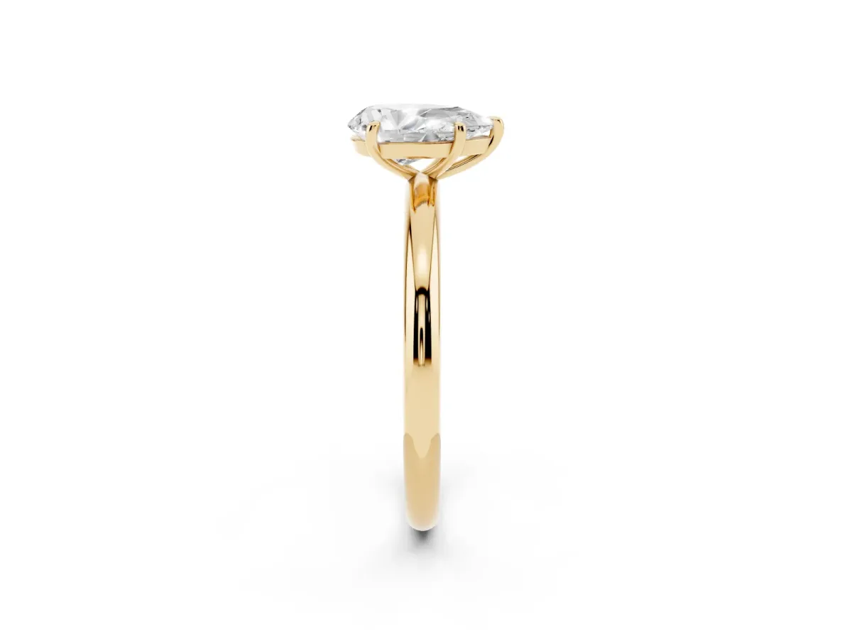 Pear Cut Solitaire Diamond Ring with Four-Prong Setting on a Plain Band Yellow gold