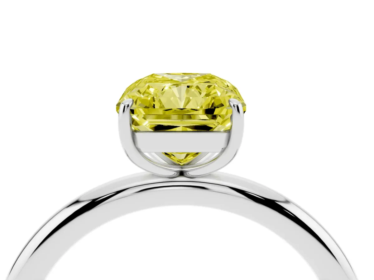 Fancy Yellow Radiant Cut Solitaire Diamond Ring with Four-Prong Setting on a Plain Band Platinum