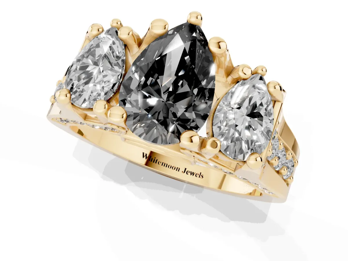 Fancy Black Pear Cut Diamond Three-Stone Ring with Channel Set Band and Four-Prong Setting Yellow gold