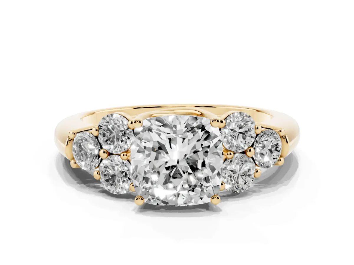 Cushion Cut Cut Diamond Cluster Ring with Round Accent Stones and Prong Setting on a Classic Band Yellow gold