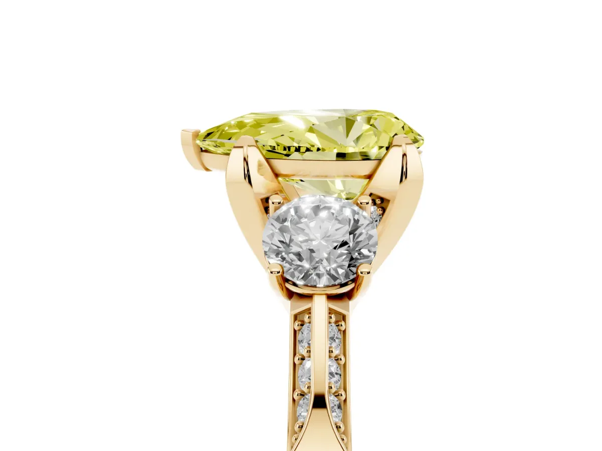 Fancy Yellow Pear Cut Brilliant Three-Stone Diamond Ring with Pavé Band and Four-Prong Setting Yellow gold
