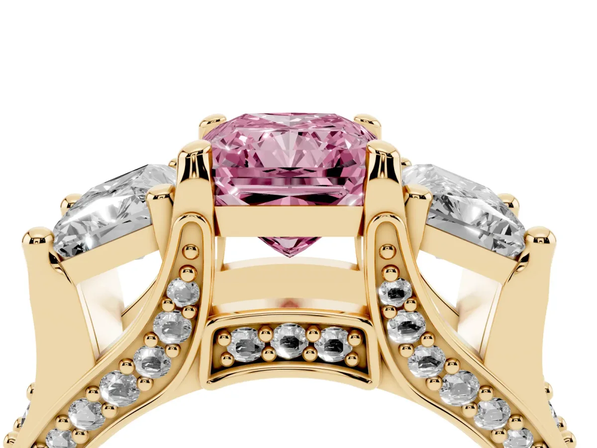 Fancy Pink Radiant Cut Diamond Three-Stone Ring with Channel Set Band and Four-Prong Setting Yellow gold