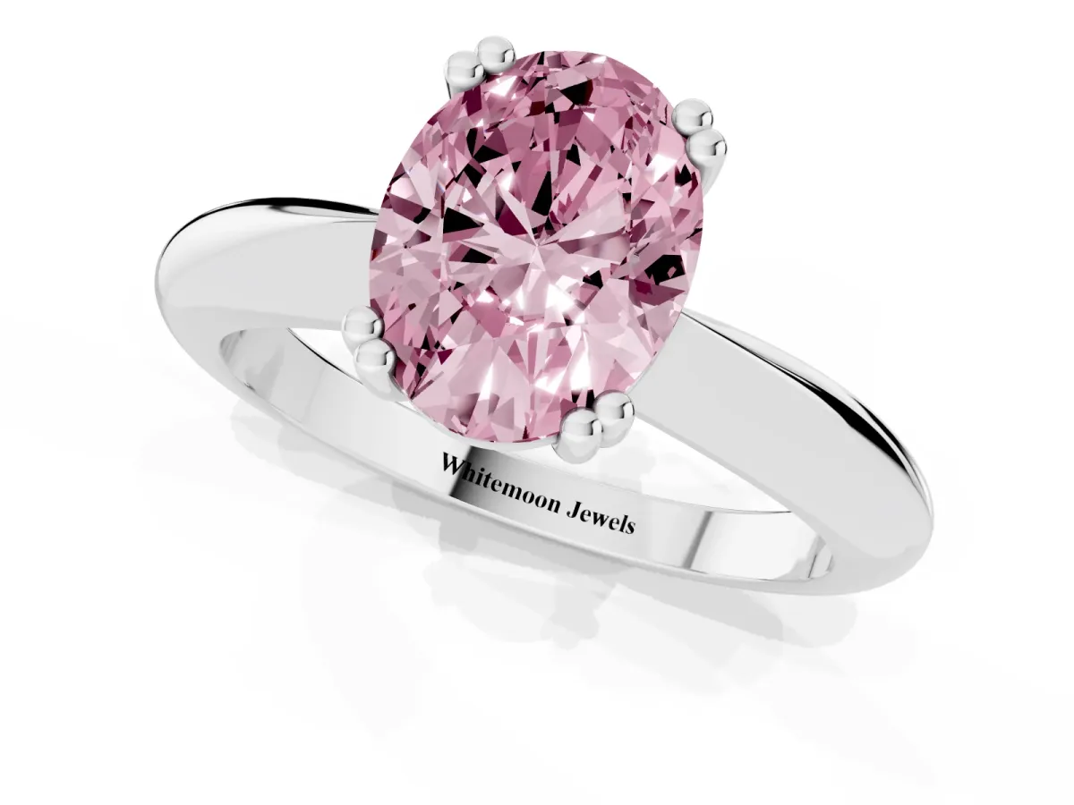 Fancy Pink Oval Cut Cut Solitaire Engagement Ring with Tapered Band and Four-Prong Setting Silver