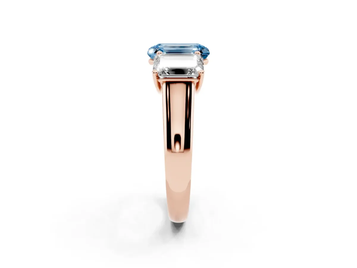Fancy Blue Emerald Cut Three-Stone Diamond Ring with Prong Setting on a Classic Band Rose gold