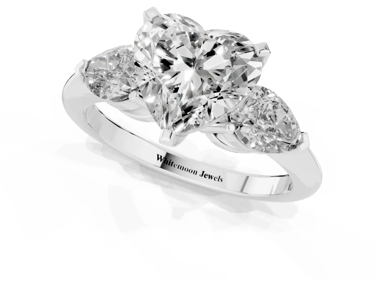 Three-Stone Heart Cut Diamond Ring with Pear Side Stones and Four-Prong Setting Platinum