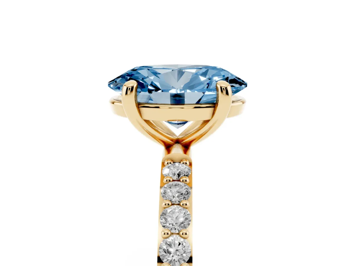 Fancy Blue Oval Cut Diamond Solitaire Ring with Round Pavé Band and Prong Setting Yellow gold