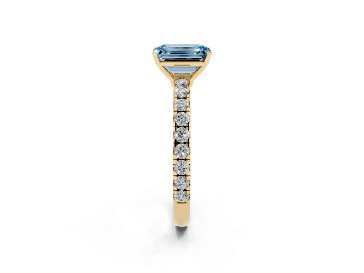 Fancy Blue Emerald Cut Diamond Pavé Solitaire Engagement Ring with Four-Prong Setting Yellow gold