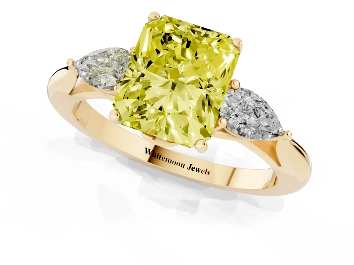 Fancy Yellow Three-Stone Radiant Cut Diamond Ring with Pear Side Stones in Four-Prong Setting Yellow gold
