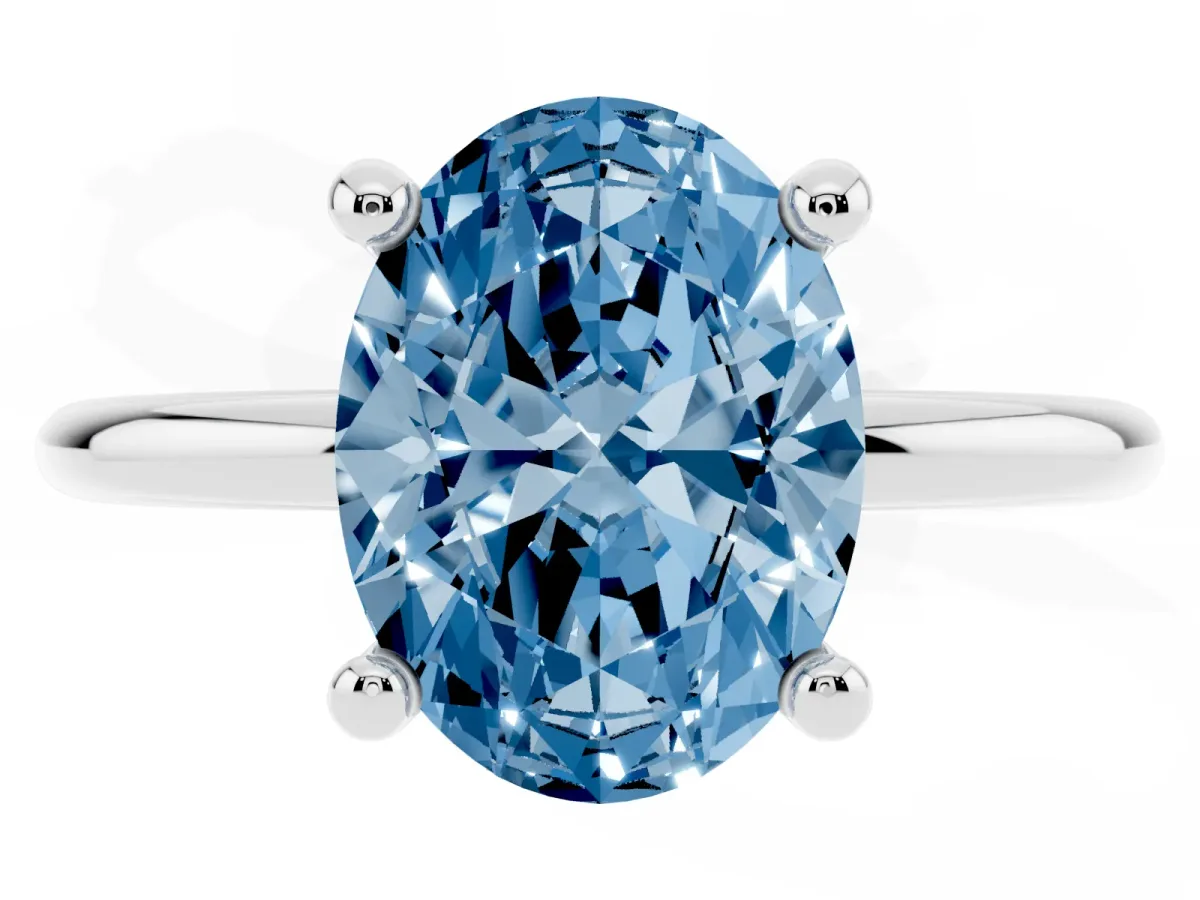 Fancy Blue Oval Cut Solitaire Diamond Ring with 4-Prong Setting on a Classic Band Silver