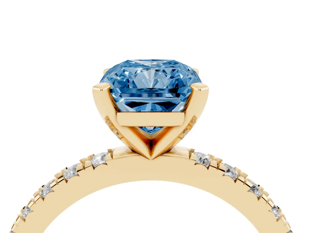 Fancy Blue Radiant Cut Diamond Pavé Band Solitaire with Four-Prong Setting Yellow gold