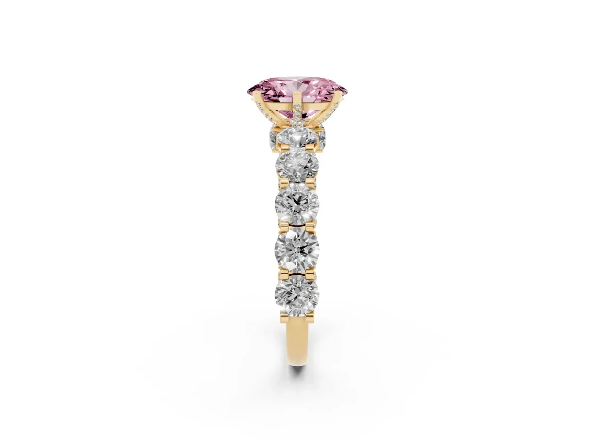 Fancy Pink Oval Cut Diamond Side Stone Engagement Ring with Four-Prong Setting Yellow gold