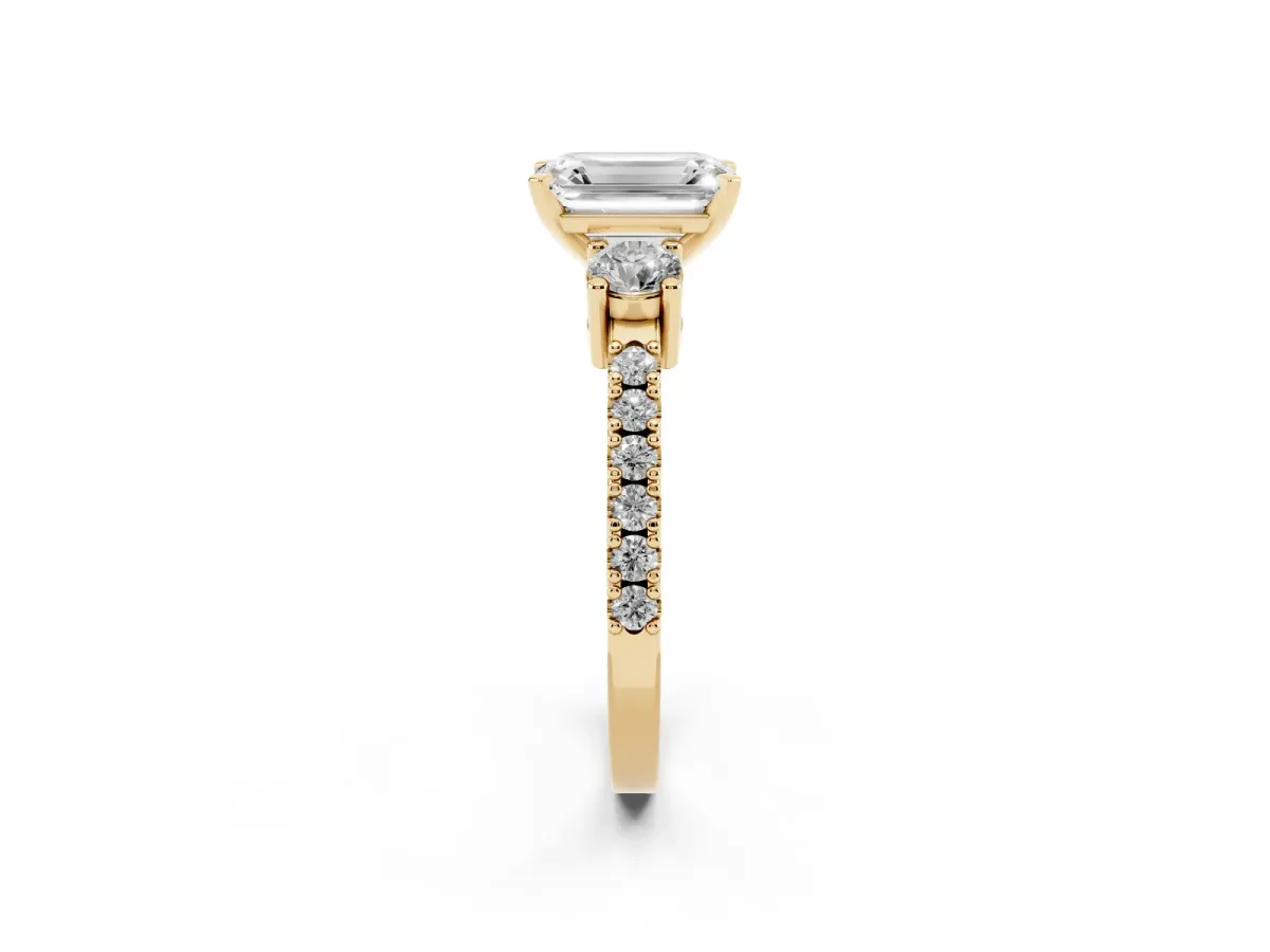 Emerald Cut Three-Stone Diamond Pavé Band with Prong Setting Yellow gold