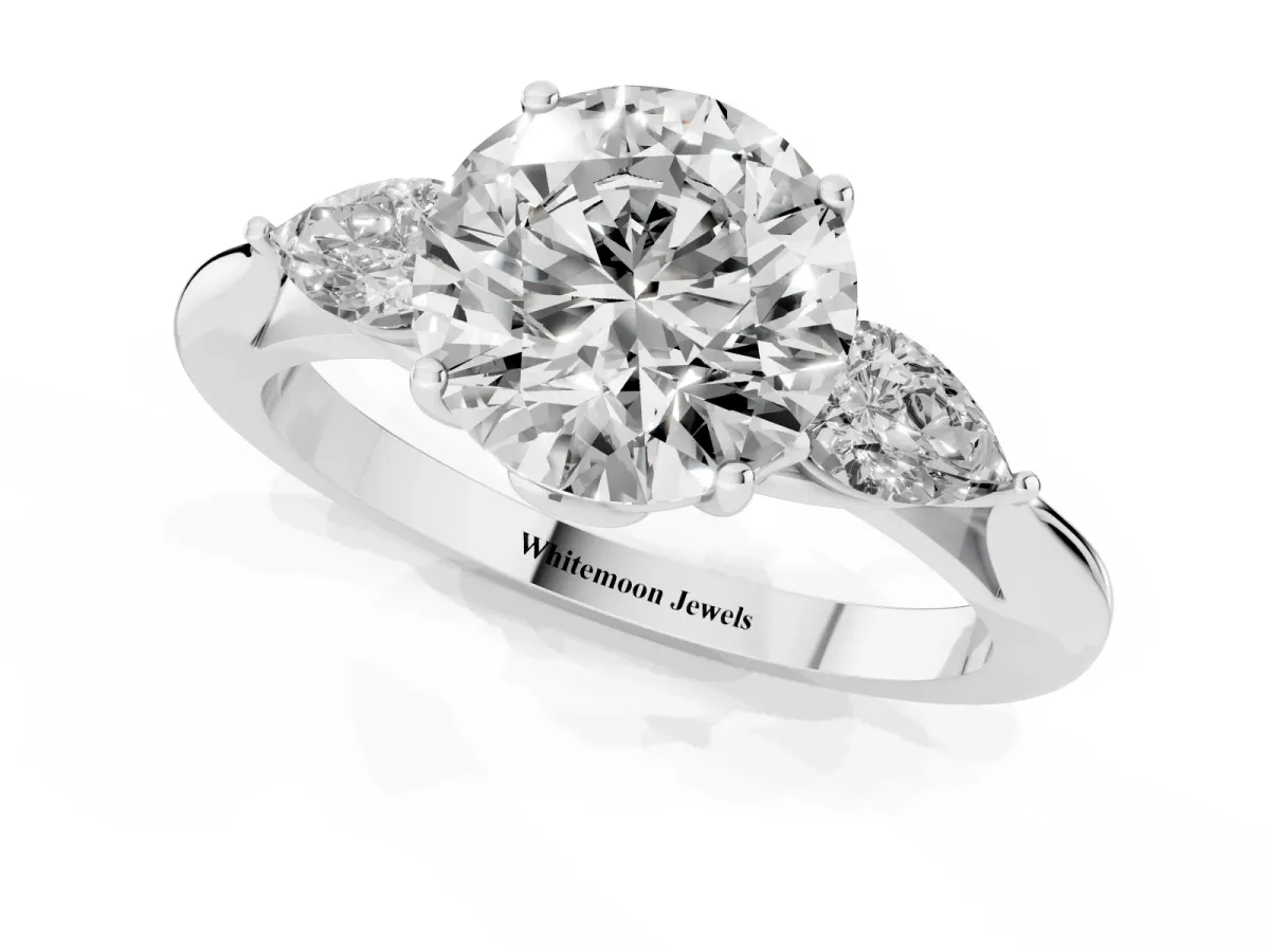 Three-Stone Round Cut Brilliant Diamond Solitaire Ring with Tapered Band and Four-Prong Setting Silver