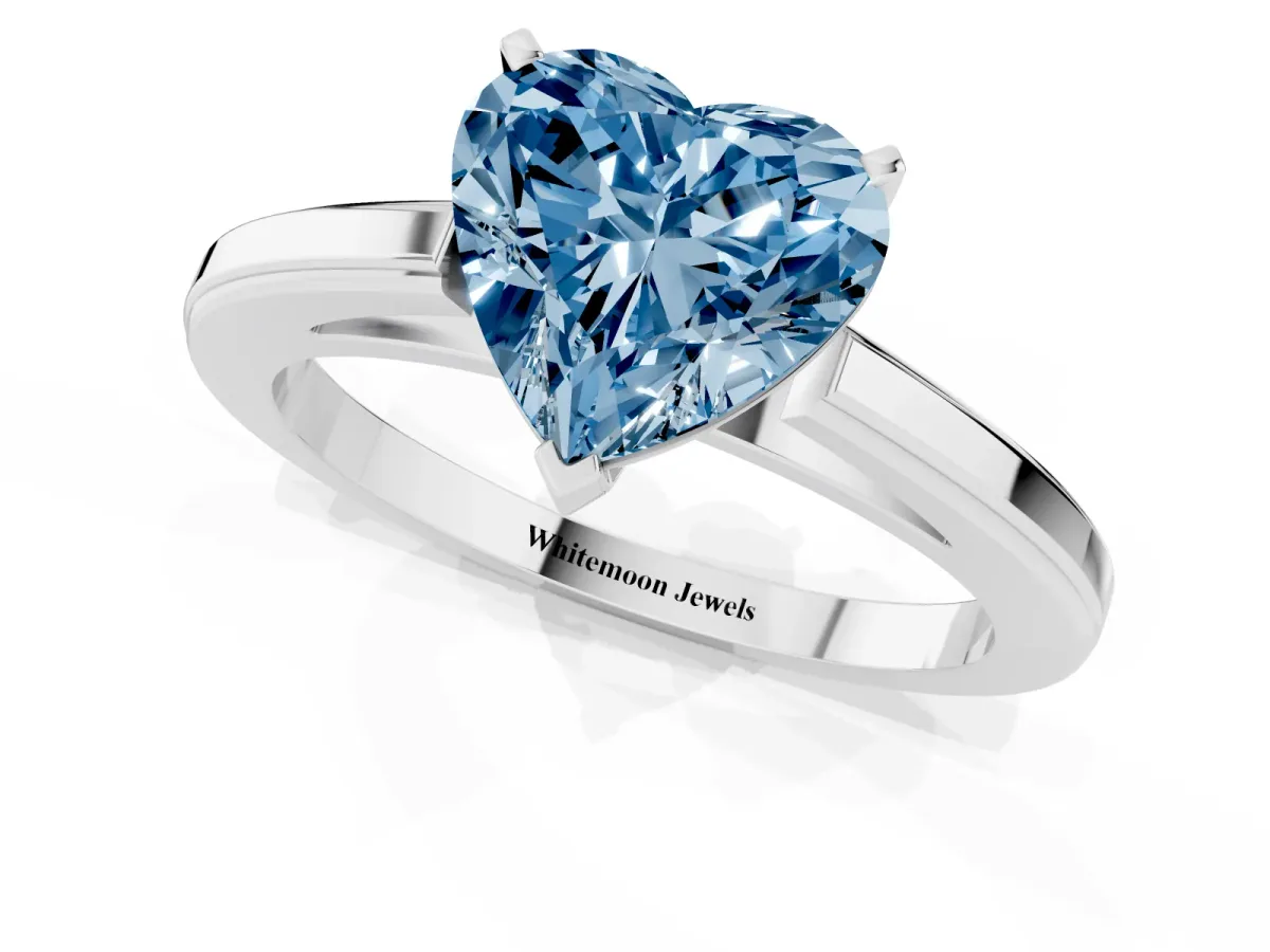 Fancy Blue Heart Cut Solitaire Diamond Ring with Four-Prong Setting and Classic Band Platinum